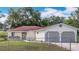 Charming single-story home with a fenced yard and a two-car garage at 70 Sapphire Rd, Ocala, FL 34472