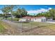 Single-story home featuring a fenced yard, well-maintained lawn, and a two-car garage in a suburban setting at 70 Sapphire Rd, Ocala, FL 34472