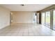 Open living space with tile flooring and sliding glass doors to a patio at 70 Sapphire Rd, Ocala, FL 34472