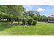 A serene backyard offering a tranquil escape with lush greenery and a charming pool area at 8205 Sw 100Th Lane Rd, Ocala, FL 34481