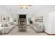 Bright living room with a brick fireplace, neutral furniture, and plenty of natural light at 8205 Sw 100Th Lane Rd, Ocala, FL 34481