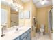 Bathroom with vanity, large mirror and a combination tub and shower at 8554 Sw 63Rd Ct, Ocala, FL 34476