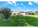 Charming single-story home with a well-manicured lawn and vibrant landscaping on a sunny day at 8554 Sw 63Rd Ct, Ocala, FL 34476