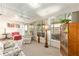 Bright sunroom with many windows, fan, and comfortable furniture at 8554 Sw 63Rd Ct, Ocala, FL 34476