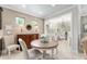Cozy breakfast nook with natural light, wooden table, and neutral color scheme at 9158 Sw 65Th Loop, Ocala, FL 34481