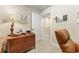 Bright office area with wood desk, decor, and an open doorway at 9158 Sw 65Th Loop, Ocala, FL 34481