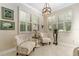 Inviting sitting room with shuttered windows, comfortable seating, and stylish lighting at 9158 Sw 65Th Loop, Ocala, FL 34481