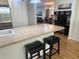 Bright kitchen island with seating, open to living and dining areas at 9255 Sw 90Th Ct # B, Ocala, FL 34481