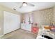 Bright and airy bedroom with a ceiling fan, closet and neutral color scheme at 9420 Ne 12Th Ct, Ocala, FL 34479