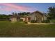 Charming single-story home featuring a stone facade and well-maintained landscaping at 9420 Ne 12Th Ct, Ocala, FL 34479