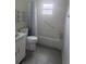 Bathroom features a shower-tub combo with tile surround and neutral decor at 9722 Sw 95Th Ct # C, Ocala, FL 34481
