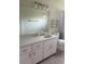Bathroom with a large mirror, sink, vanity and a combination shower and bathtub at 9722 Sw 95Th Ct # C, Ocala, FL 34481