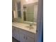 Bathroom vanity featuring a large mirror, natural light, and generous counter space at 9722 Sw 95Th Ct # C, Ocala, FL 34481
