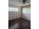 Bedroom with hardwood floors, ample natural light, and multiple windows at 9722 Sw 95Th Ct # C, Ocala, FL 34481