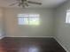 Bedroom with hardwood floors, multiple windows, and neutral wall colors at 9722 Sw 95Th Ct # C, Ocala, FL 34481