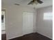 Bedroom features standard closet with white doors and ceiling fan with light fixture at 9722 Sw 95Th Ct # C, Ocala, FL 34481