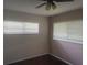 Standard bedroom with two windows for great natural light and ceiling fan at 9722 Sw 95Th Ct # C, Ocala, FL 34481