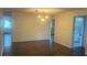 The dining area offers wood flooring and an elegant chandelier for ambient lighting at 9722 Sw 95Th Ct # C, Ocala, FL 34481
