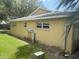 A view of the side exterior of a home surrounded by lush greenery at 9722 Sw 95Th Ct # C, Ocala, FL 34481