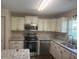 Newly remodeled kitchen featuring stainless steel appliances and granite countertops at 9722 Sw 95Th Ct # C, Ocala, FL 34481
