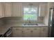 Spacious kitchen features stainless steel appliances, granite countertops, and a window above the sink at 9722 Sw 95Th Ct # C, Ocala, FL 34481