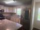Spacious kitchen features granite countertops, stainless appliances, and ample natural light at 9722 Sw 95Th Ct # C, Ocala, FL 34481