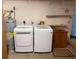 Laundry area with washer, dryer, and water heater at 9722 Sw 95Th Ct # C, Ocala, FL 34481