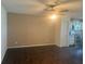 Open living area with ceiling fan and view of the newly remodeled kitchen at 9722 Sw 95Th Ct # C, Ocala, FL 34481