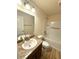 Bright bathroom featuring a tub and shower combo, with a vanity, sink, and wood-look tile flooring at 10405 Sw 47Th Ave, Ocala, Florida, FL 34476