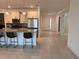 Bright kitchen with island seating, stainless steel appliances, and tile flooring at 10584 Sw 91St Street Rd, Ocala, FL 34481