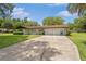 Charming single-story home with a well-maintained front yard and long driveway at 12178 Palmetto Way, Dunnellon, FL 34432