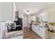 Modern kitchen featuring granite countertops, stainless steel appliances, and white cabinets at 1245 Nw 67Th Pl, Ocala, FL 34475