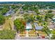 Aerial view of a blue home featuring a refreshing pool and well-maintained surroundings at 1404 Richmond Rd, Lakeland, FL 33801
