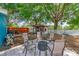 Backyard patio with outdoor seating area featuring fire pit and quaint outdoor building at 1404 Richmond Rd, Lakeland, FL 33801