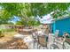 Spacious backyard featuring a patio, deck, pool, and ample seating for outdoor enjoyment at 1404 Richmond Rd, Lakeland, FL 33801