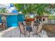 Backyard patio seating area with stylish furniture, a fire pit, and an outdoor shed at 1404 Richmond Rd, Lakeland, FL 33801