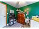 A cute bedroom with a television, a dresser and a comfortable bed at 1404 Richmond Rd, Lakeland, FL 33801