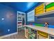 This bedroom has colorful storage, a built-in desk, and an organized closet at 1404 Richmond Rd, Lakeland, FL 33801