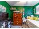 This is a cozy bedroom with shelves, storage, and a comfortable bed at 1404 Richmond Rd, Lakeland, FL 33801