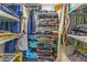 Walk-in closet with organized shelves, clothes, and storage containers at 1404 Richmond Rd, Lakeland, FL 33801
