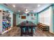 Light-filled dining room featuring tile floors, a large wooden table, and whimsical decorative accents at 1404 Richmond Rd, Lakeland, FL 33801