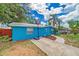 Charming home exterior with a basketball hoop and beautiful landscaping at 1404 Richmond Rd, Lakeland, FL 33801