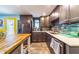 Stylish kitchen boasting gray cabinets, sleek countertops, stainless steel appliances, and backsplash at 1404 Richmond Rd, Lakeland, FL 33801
