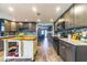 Spacious kitchen with wooden floors, center island, and stainless steel appliances at 1404 Richmond Rd, Lakeland, FL 33801