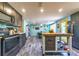 Modern kitchen featuring gray cabinets, a butcher block island, and a view into the dining area at 1404 Richmond Rd, Lakeland, FL 33801