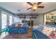 Relaxing living room with blue couches and seamless flow into the kitchen at 1404 Richmond Rd, Lakeland, FL 33801