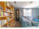 Bright living room with book shelves and large windows at 1404 Richmond Rd, Lakeland, FL 33801