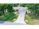 A home with mature trees, a driveway, and a two-car garage at 1553 Ne 161St Pl, Citra, FL 32113