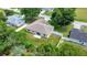 Aerial view of a home showing the backyard with a white fence and lawn at 1553 Ne 161St Pl, Citra, FL 32113