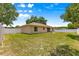 Expansive backyard featuring green grass and a white vinyl fence at 1553 Ne 161St Pl, Citra, FL 32113